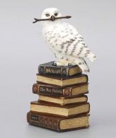 A Snowy Owl Atop A Stack of Books Premium Figure
